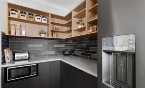 Modern pantry with open shelves and black tiles