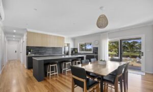 Modern open-plan kitchen and dining area with island