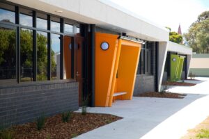 Modern building with colourful angular entrance structures