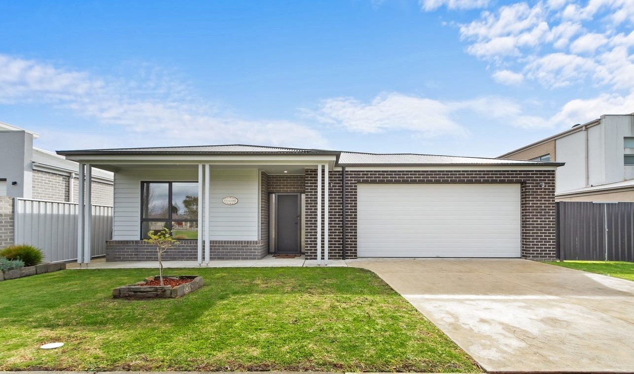 Modern single-storey brick home with double garage