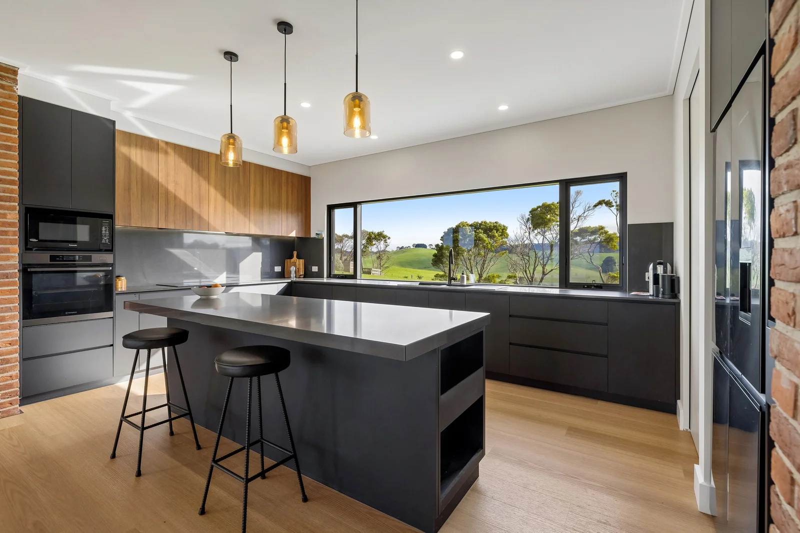 Modern kitchen with island and countryside views